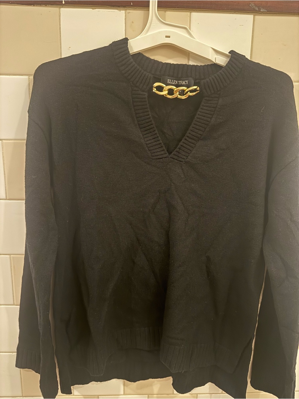 Ellen Tracy Black V‑Neck Sweater with Gold Chain Accent
